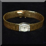 J19. 14K Gold and diamond watch. 